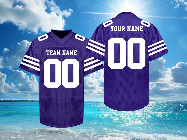 May include: Two purple football jerseys with white accents. One jersey displays "TEAM NAME" and the number "00", the other displays "YOUR NAME" and the number "00". The jerseys have white stripes on the sleeves.