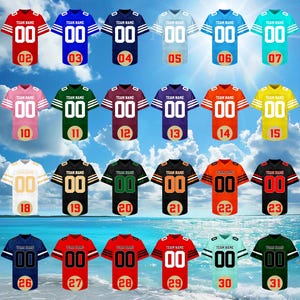 May include: A collection of 32 football jerseys in various colors, including black, red, blue, green, and orange. Each jersey features a team name and the number "00" on the front and back, with a unique number on the bottom.