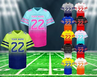 May include: A collection of football jerseys in various colors, including blue, pink, yellow, and black. Each jersey features the number "22" and space for a team name. The jerseys are displayed on a green field with yard lines.