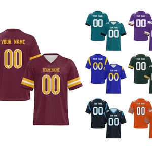May include: Assorted football jerseys in various colors, including maroon, teal, purple, blue, green, black, and orange. Each jersey features the number "00" in white with a gold outline. Some jerseys have "YOUR NAME" or "TEAM NAME" printed above the number.
