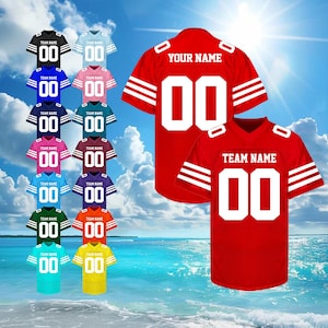 May include: A collection of customizable football jerseys in various colors, including black, blue, pink, and green. Each jersey features the number "00" and space for a team name. Two red jerseys with white stripes and text are also displayed.