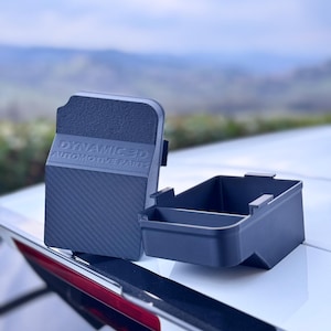 May include: Two black plastic storage containers with a carbon fiber pattern on the lid. The lid has the text "DYNAMIC 3D AUTOMOTIVE PARTS" embossed on it.