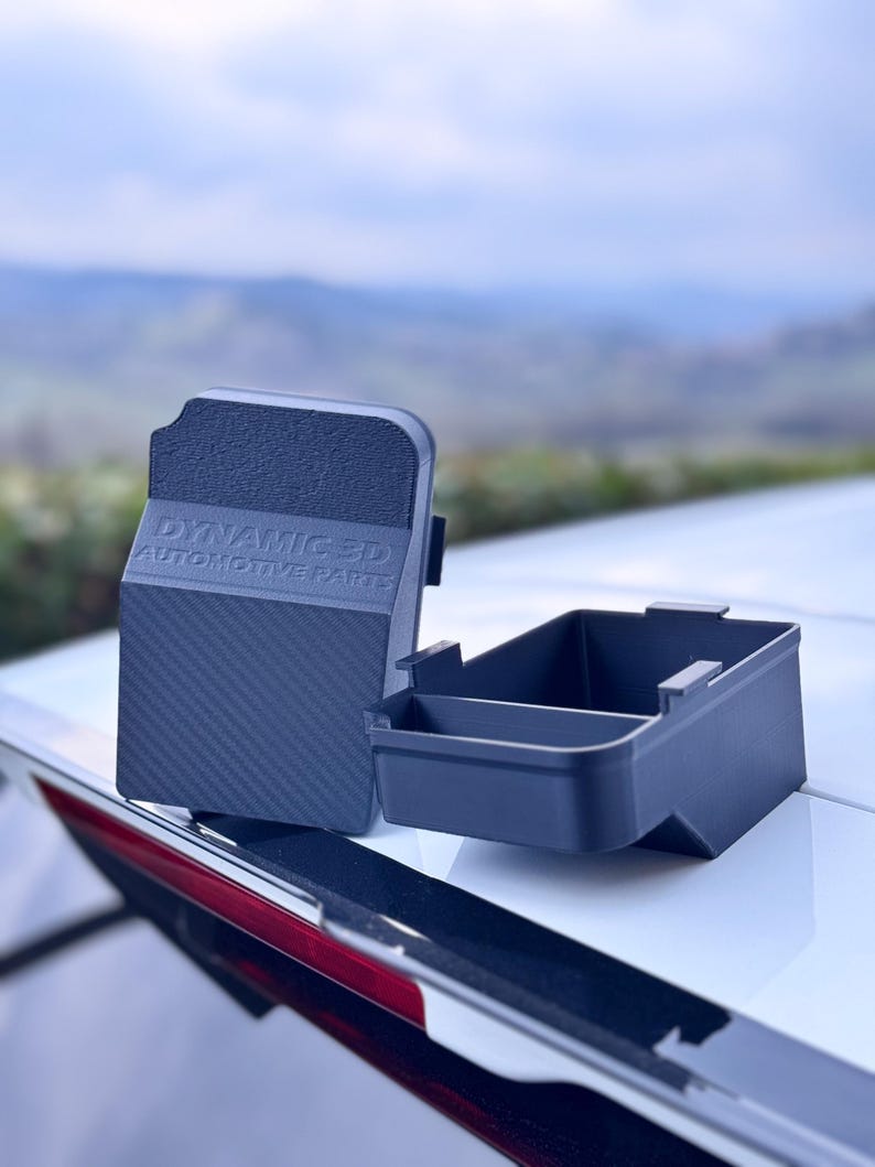 May include: Two black plastic storage containers with a carbon fiber pattern on the lid. The lid has the text "DYNAMIC 3D AUTOMOTIVE PARTS" embossed on it.