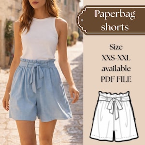 May include: Pale blue paperbag shorts with a high waist and tie, worn with a white vest top. The image shows a person walking on a cobbled street. Text on the image reads "Paperbag shorts" and "Size XXS-XXL available PDF FILE."