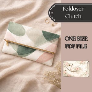 Peut inclure: Pochette pliable avec un motif aquarelle dans les tons de vert, rose et beige. La pochette a une fermeture éclair dorée et le texte "Foldover Clutch", "ONE SIZE PDF FILE".