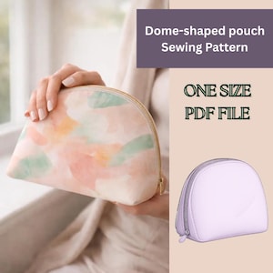 May include: A dome-shaped pouch with a watercolor design in pink, peach, and green hues. The pouch has a gold zipper and is held by a person. Text on the image reads "Dome-shaped pouch Sewing Pattern" and "ONE SIZE PDF FILE".
