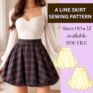 May include: A Line skirt sewing pattern. The image shows a woman wearing a plaid skirt with a white top. The skirt is a dark color with red plaid lines. The text on the image says "Sizes 00-32 available PDF file."