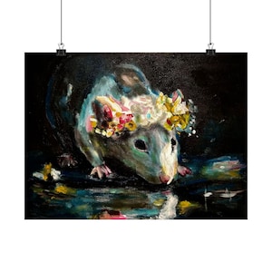 May include: An oil painting on canvas depicting a dark-furred rat wearing a vibrant floral crown made of yellow, white, and pink blossoms. The rat is positioned against a deep black background with colorful, abstract paint strokes below it.