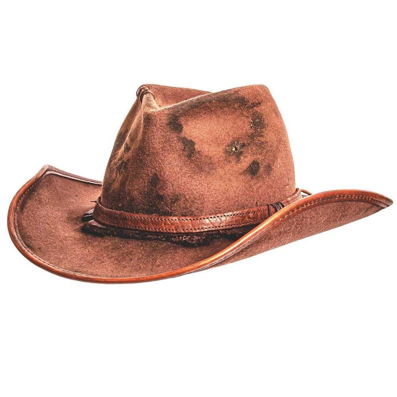 May include: A brown leather cowboy hat with a distressed, weathered texture. The hat features a pinched crown and a wide, curved brim. A matching leather band wraps around the base of the crown, adding a structured detail to the overall design.