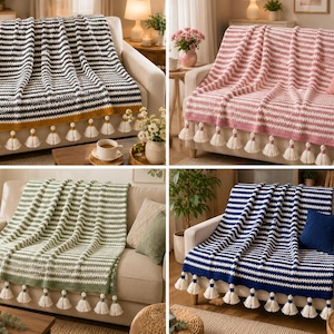 May include: A collection of four rectangular crochet throw blankets, each featuring a horizontal striped pattern in alternating colors of white and either charcoal, pink, sage green, or navy blue, finished with white tassels along the bottom edge.