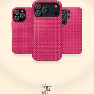 May include: Three phone cases featuring a repeating pink and magenta floral geometric pattern. The cases have black camera cutouts and are MagSafe Compatible. The bottom includes the text Smyrna Art Galery DIGITAL & PHYSICAL PRODUCT.