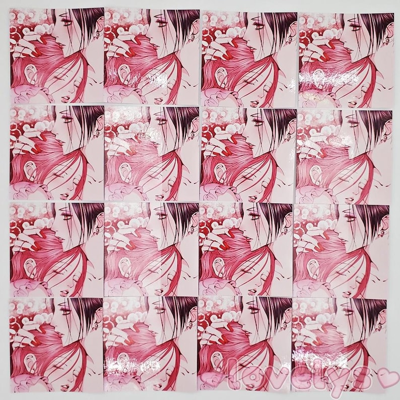 May include: A set of 16 pink and white stickers featuring a couple embracing. The stickers are printed with a manga-style illustration of a man and woman with long hair.