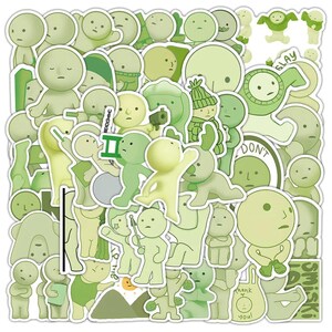 Peut inclure: Un ensemble de 50 autocollants verts et blancs repr&eacute;sentant divers personnages de dessins anim&eacute;s avec diff&eacute;rentes expressions et poses. Les autocollants comprennent des phrases comme "Slay", "Don't" et "Thank You".