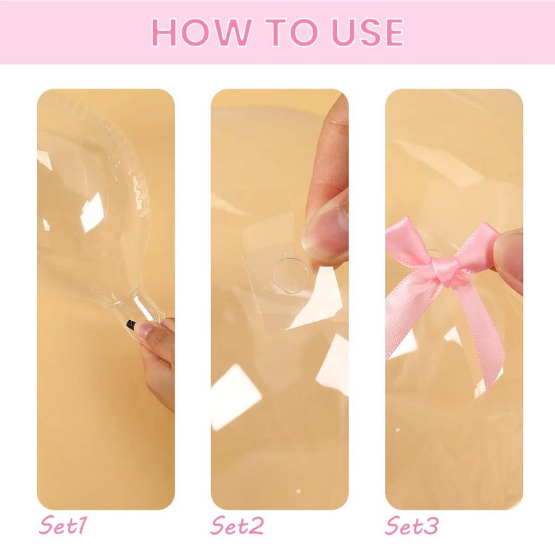 May include: Image showing a step-by-step guide with the text "HOW TO USE". The guide shows how to use a product, with three sets of images labeled Set1, Set2, and Set3. The images show a clear balloon, adhesive dots, and a pink ribbon.