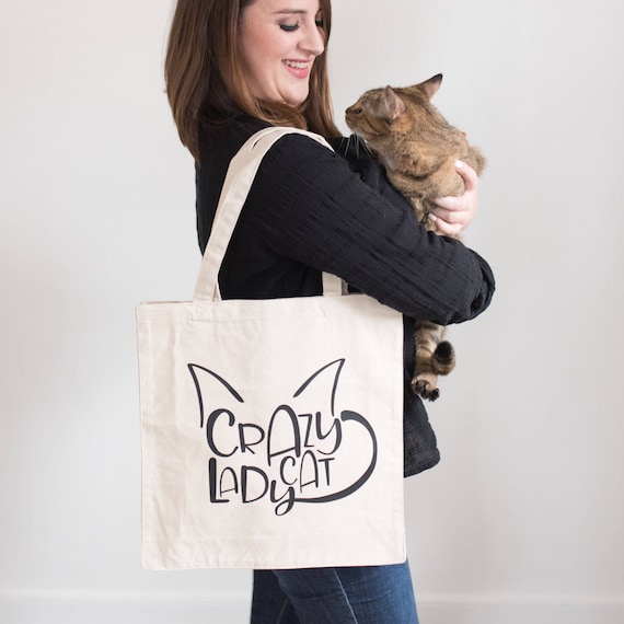 Сумка-малышка "кошка" 925035. Idiom let the cat out of the bag. Cats bag перевод. The tote bag сумка плюшевая. Cat has nine lives.