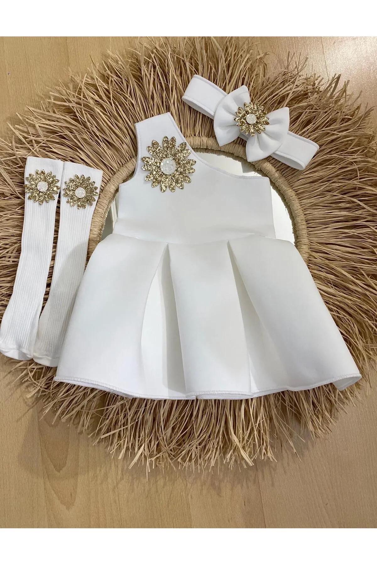 White Baby Dress Set - Gold Appliqu, Headband & Socks (6-12 Months) White Baby Dress Set - Gold Appliqu, Headband & Socks (6-12 Months)