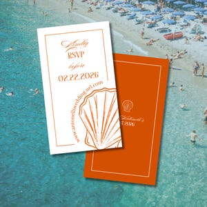 May include: Two wedding invitation cards with a beach theme. One card is white with orange text and a seashell graphic, reading "Kindly RSVP before 02.22.2026". The other card is orange with white text and a seashell graphic. The background is a beach scene.