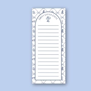 May include: A rectangular notepad with a light blue background. The notepad has a white interior with horizontal lines for writing. The border features a repeating pattern of bows, mittens, Christmas trees, and stockings in a dark blue color. The words "SWEET LITTLE LISTS" are printed at the top.