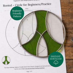May include: A stained glass peace sign with green and clear glass sections, set on a pattern sheet. The pattern is labeled "Rooted - Circle for Beginners/Practice" and includes the text "Beginner Friendly Pattern" and "Instant Download". The peace sign measures 14cm.