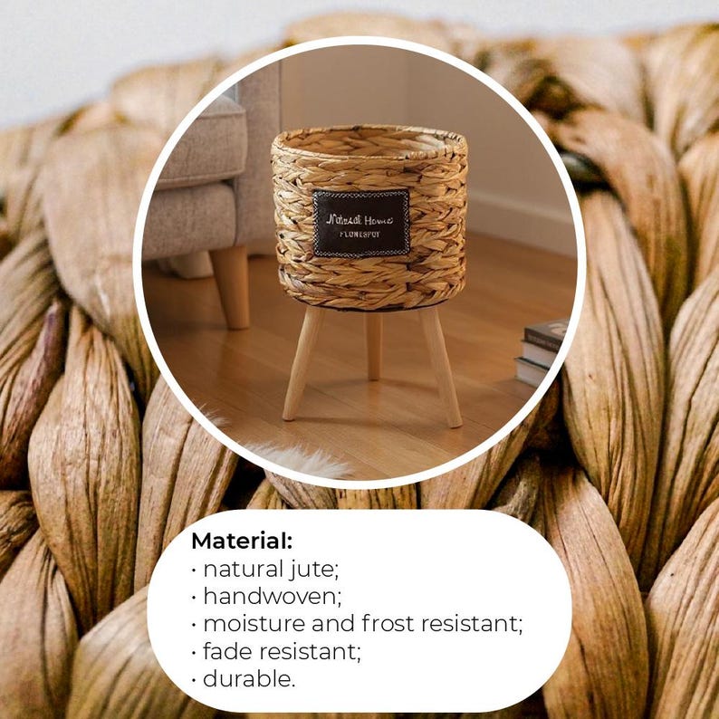 May include: A woven jute planter with three wooden legs. The planter has a cylindrical shape and features a small, rectangular label with the text "Natural Home FLOWERPOT". The natural color of the jute and wood creates a neutral, earthy aesthetic.