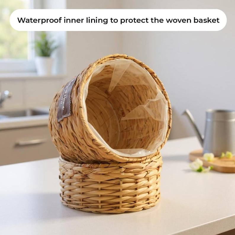 May include: Woven basket with a waterproof inner lining. The basket is made of natural-colored woven material and has a round base. The top section is oval-shaped. The text "Waterproof inner lining to protect the woven basket" is visible.