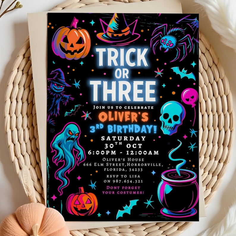 May include: A Halloween-themed invitation with a black background and neon illustrations of pumpkins, a witch's hat, a spider, a skull, and a cauldron. The text reads "Trick or Three" and announces Oliver's 3rd birthday party on October 30th.