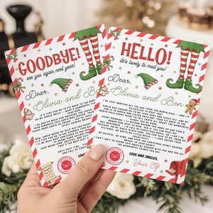 May include: Two Christmas cards with red and white striped borders, featuring elf legs and hats. One card says "Goodbye!" and the other says "Hello!". The cards are addressed to Olivia and Ben, with festive illustrations.