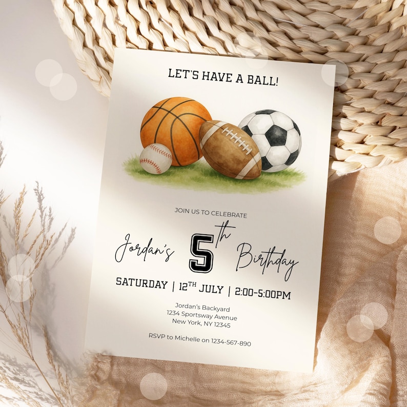 May include: Invitation card with watercolor illustrations of a basketball, football, baseball, and soccer ball on green grass. Text reads "Let's Have a Ball!" and "Jordan's 5th Birthday" with event details. Beige background.