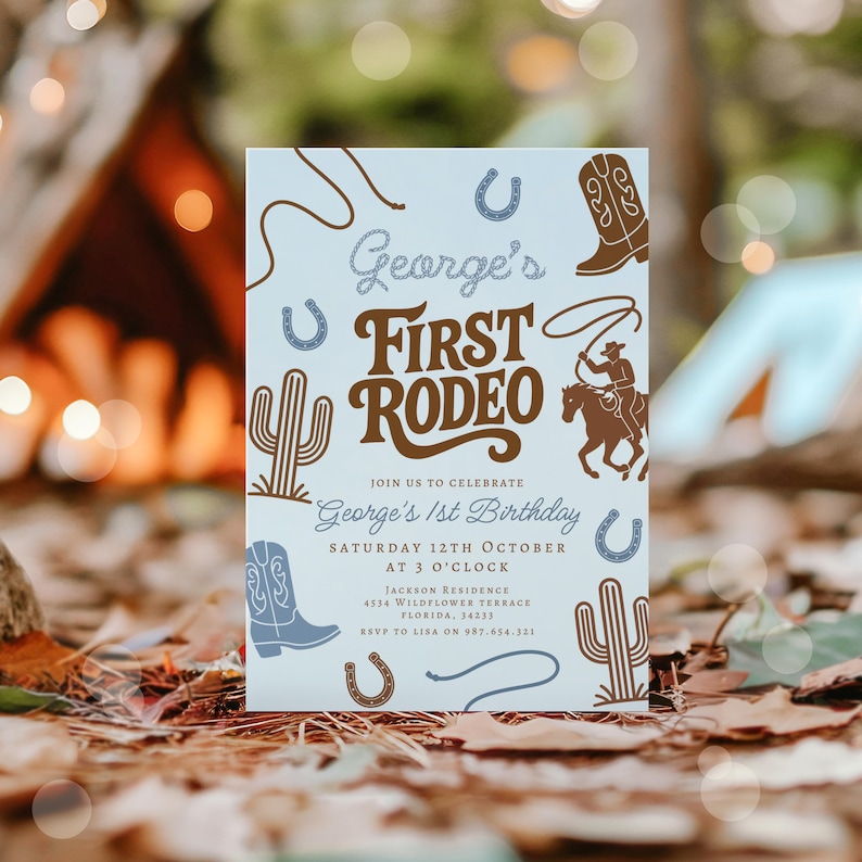 May include: A light blue invitation card with a rodeo theme. The card features illustrations of cowboy boots, cacti, horseshoes, and a cowboy on a horse. Text includes "George's First Rodeo" and birthday details.