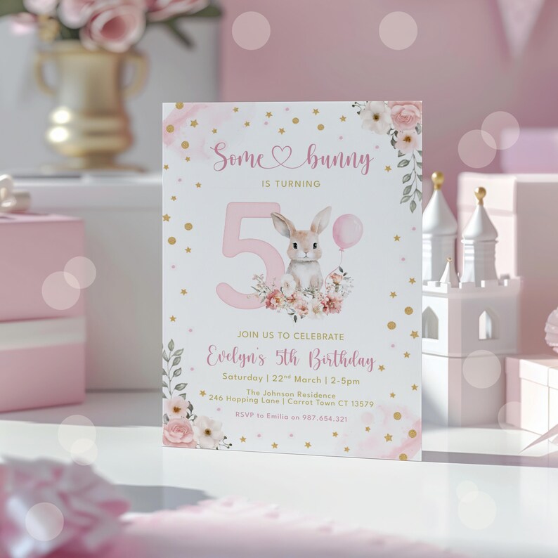 May include: A pink and white birthday invitation with the text "Some bunny is turning 5". The invitation features a watercolour illustration of a bunny holding a balloon, surrounded by flowers. The invitation includes the event details.