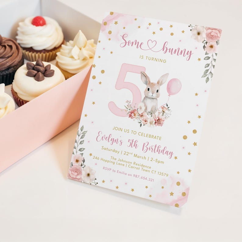 May include: A birthday invitation with the text "Some bunny is turning 5" featuring a bunny illustration, pink accents, and gold stars. Cupcakes with white and chocolate frosting are in a box.
