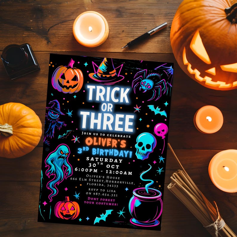 May include: A Halloween-themed invitation with the text "Trick or Three" and a variety of spooky illustrations. The invitation includes details for Oliver's 3rd birthday party, with pumpkins, candles, and a carved jack-o'-lantern.