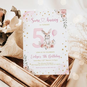 May include: A pink and white birthday invitation with the text "Some bunny is turning 5". The invitation features a bunny illustration, floral accents, and gold stars. Details include the birthday girl's name, date, time, and location.