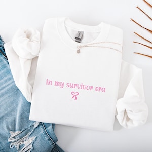 Personalized In My Warrior Fighter Survivor Era Sweatshirt | Pink Ribbon Breast Cancer Awareness Crewneck | Her Daily Tee