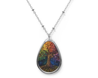May include: A silver chain necklace with a teardrop-shaped pendant featuring a colorful tree of life design.