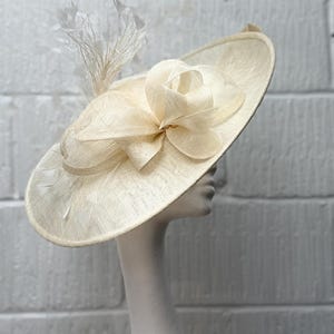 Ivory Cream Sinamay Hatinator: Looped Bow & Feather Fascinator