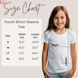 May include: A size chart for youth short sleeve tees, with measurements in inches. The chart includes sizes S, M, LT, and XL, with corresponding width and length measurements. A young girl is wearing a white tee, with width and length indicators.