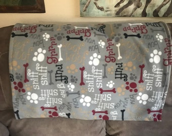 Fleece dog blanket, grey background, with various words, sniff, grrrr, ruff, woof woof, and paws and bones (27"x33")