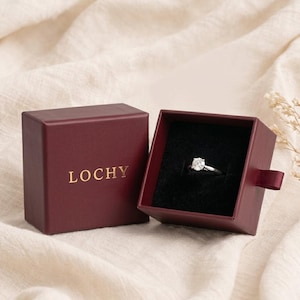 May include: A set of three ceramic nesting bowls in shades of blue, green, and white. The bowls feature a speckled glaze and a simple, modern design. The largest bowl measures approximately 6 inches in diameter.