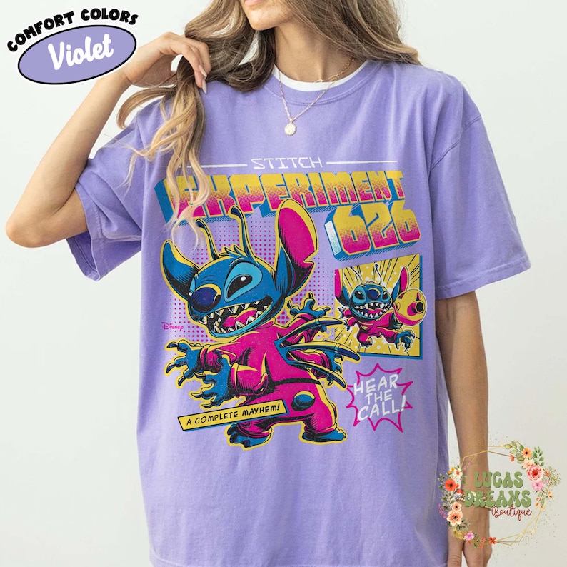 May include: Violet Comfort Colors t-shirt featuring Stitch from Lilo & Stitch. The graphic includes Stitch in a pink and blue outfit with the text "Experiment 626" and "A Complete Mayhem!"