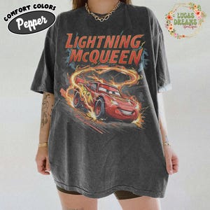 May include: A set of three ceramic mugs with a speckled, matte finish. The mugs are in shades of cream, light gray, and dark gray. Each mug has a simple, minimalist design, perfect for coffee or tea.