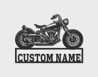 May include: A black metal wall art piece featuring a detailed silhouette of a motorcycle positioned above a rectangular frame. The frame contains the text CUSTOM NAME in bold, capitalized, sans-serif lettering, creating a cohesive design.