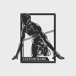 May include: Black metal wall art showing a runner in a starting position, framed within a rectangular border. The text "CUSTOM NAME" is displayed at the bottom. The runner is wearing athletic attire.