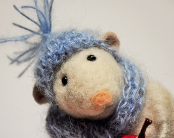 Little cute needle felted winter mouse from wool in blue hat and scarf