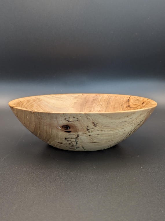 Hand-turned on a lathe from spalted maple — the wild, ink-black fungal streaks make every single bowl a one-of-a-kind piece of functional art.