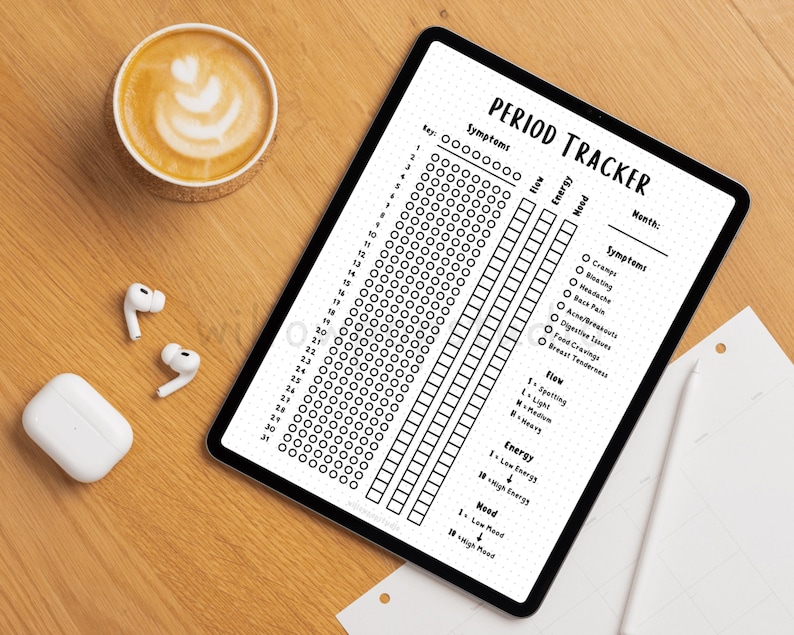 May include: A digital tablet displaying a black and white period tracker template with the text PERIOD TRACKER, a numbered list from 1 to 31, columns for flow, energy, and mood, and a checklist of symptoms including cramps, bloating, and headaches.