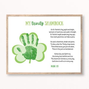 May include: A framed print featuring a green handprint within a shamrock design, with the text "MY trinity SHAMROCK" at the top. The print includes a poem about St. Patrick's Day and the Trinity. The words "MADE BY:" are at the bottom.
