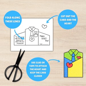 May include: A Father's Day card template in the shape of a shirt, with instructions and a completed example. The card includes the text "Happy Father's Day!" and a Bible verse. A pair of black scissors is also present.