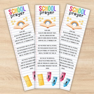 May include: Three colorful bookmarks with the text "SCHOOL prayer". Each bookmark features a rainbow, open book, and stars. The bookmarks also include a school prayer and illustrations of a ruler and crayons.