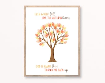 May include: A framed print with a watercolour illustration of a tree with autumnal leaves. The artwork includes the text "EVEN WHEN I fall LIKE THE AUTUMN leaves GOD IS ALWAYS there TO PICK ME BACK up."